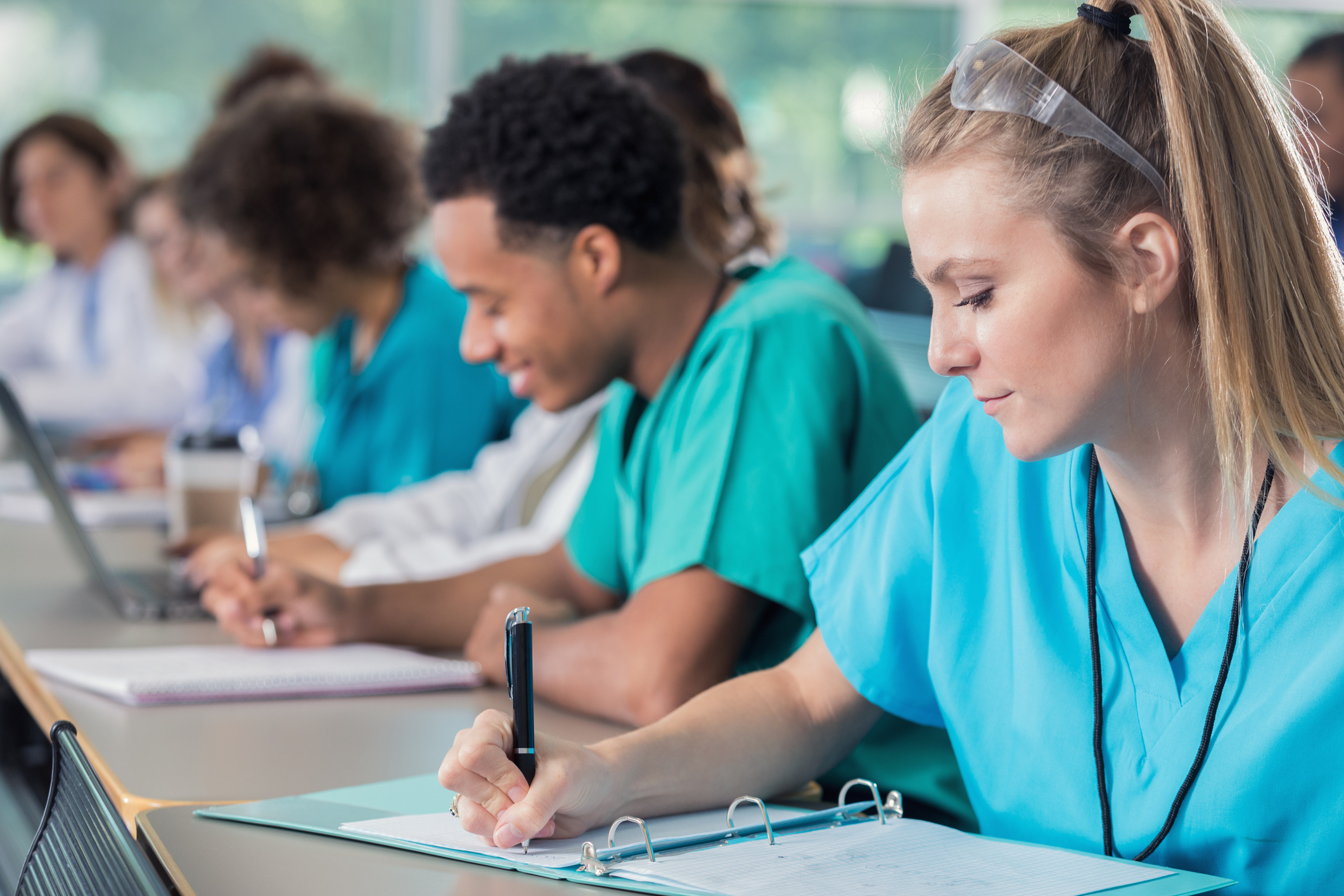 Focus medical students take notes during lecture